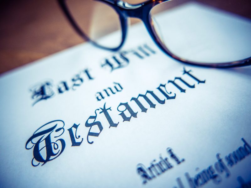 Retro Styled Detail Of A Last Will And Testament Document With Glasses